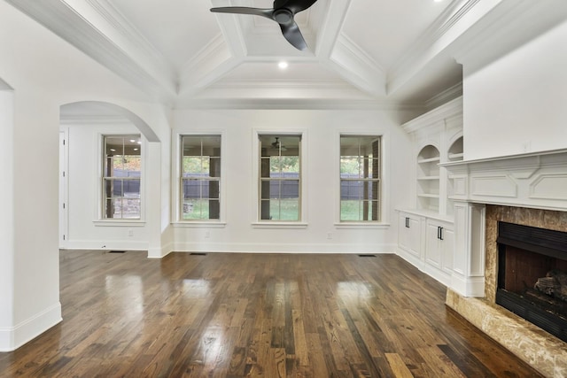 unfurnished living room featuring crown molding, dark hardwood / wood-style flooring, and a high end fireplace