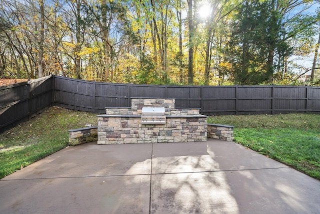 view of patio / terrace featuring a grill and exterior kitchen