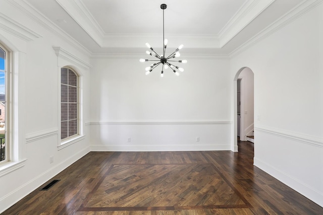 unfurnished dining area with a chandelier, ornamental molding, and a healthy amount of sunlight