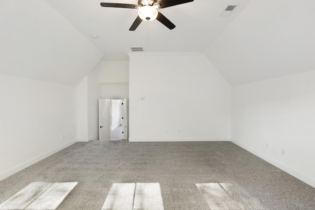 additional living space with ceiling fan, carpet floors, and lofted ceiling