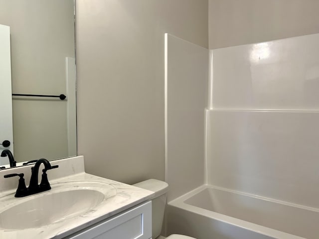 full bathroom featuring shower / tub combination, vanity, and toilet