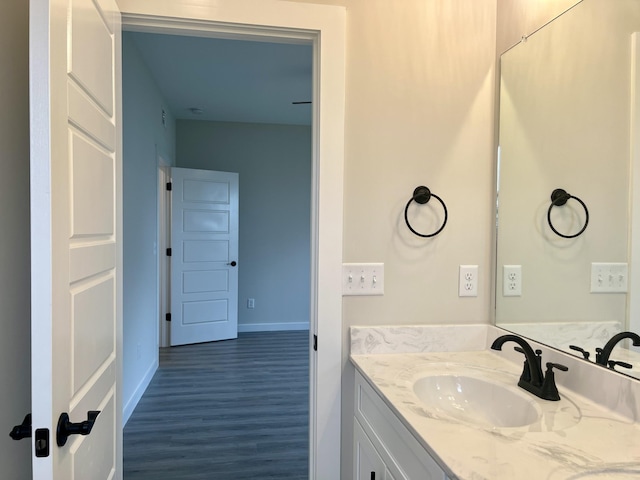 bathroom featuring vanity and hardwood / wood-style flooring