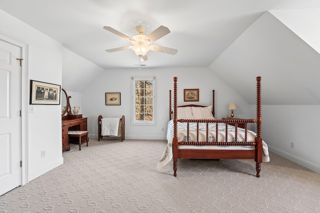 carpeted bedroom with vaulted ceiling and ceiling fan