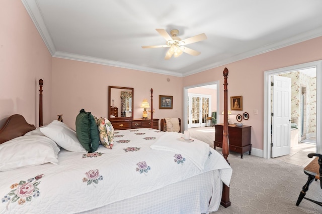 bedroom featuring light carpet, ensuite bath, ceiling fan, and ornamental molding