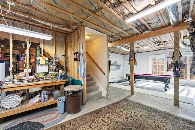 basement featuring a workshop area and pool table