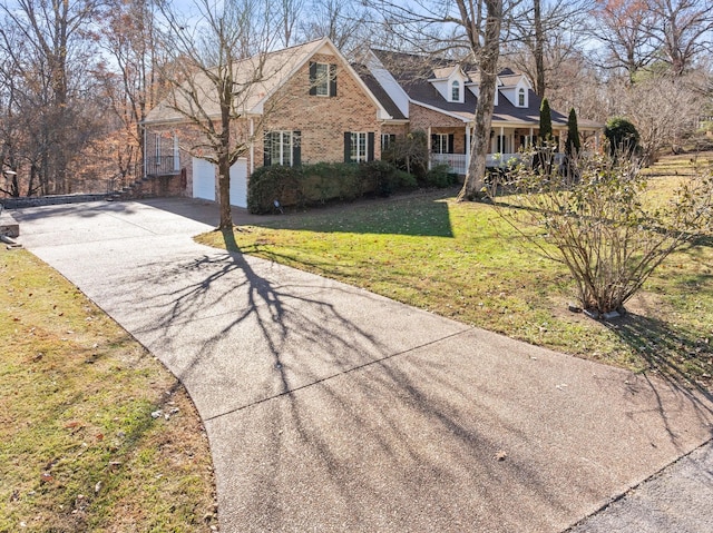 view of front of house featuring covered porch and a front yard