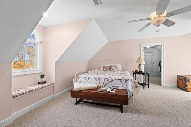 bedroom featuring light carpet, ceiling fan, and vaulted ceiling