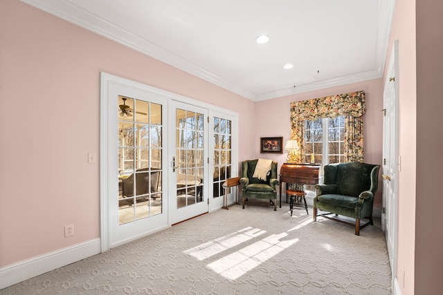 living area featuring french doors, carpet floors, plenty of natural light, and crown molding