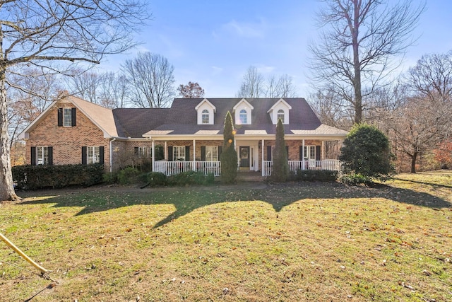 cape cod-style house with a porch and a front yard