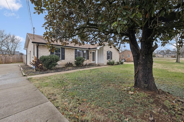 ranch-style house with a front yard