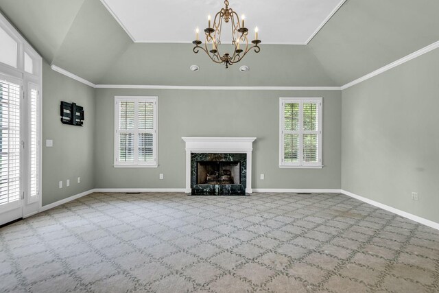 unfurnished living room featuring light colored carpet, vaulted ceiling, and plenty of natural light