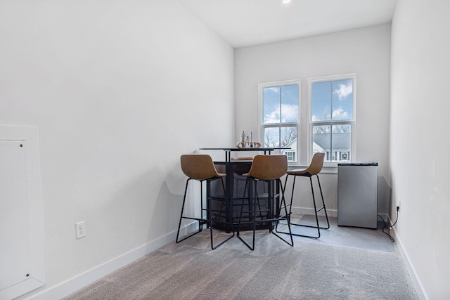 view of carpeted dining area