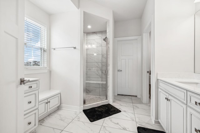 bathroom featuring vanity and an enclosed shower