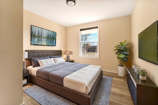 bedroom featuring light wood-type flooring