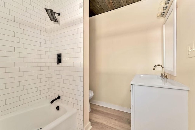 full bathroom with wooden ceiling, wood-type flooring, toilet, vanity, and tiled shower / bath