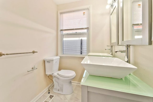 bathroom with toilet and sink