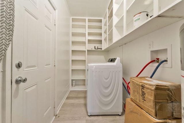 washroom featuring independent washer and dryer and light wood-type flooring