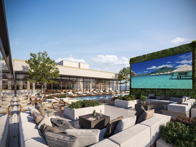 view of patio with outdoor lounge area and a community pool