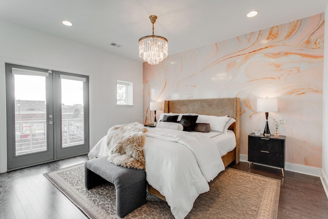 bedroom with access to exterior, french doors, dark hardwood / wood-style floors, and an inviting chandelier