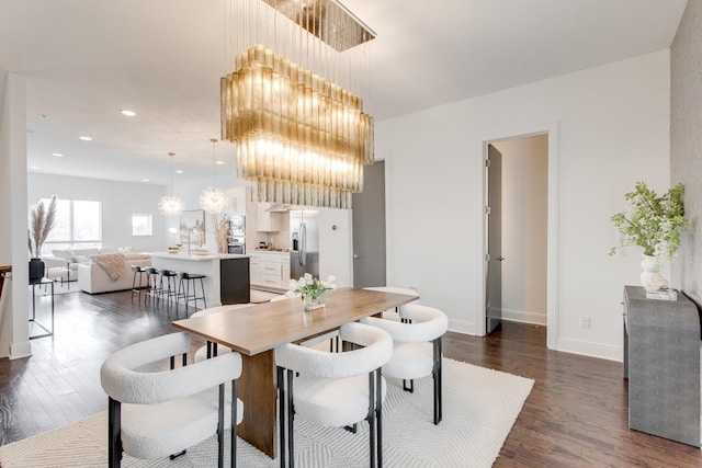 dining room featuring dark wood-type flooring and a notable chandelier