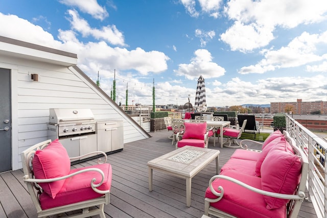 deck featuring outdoor lounge area and grilling area