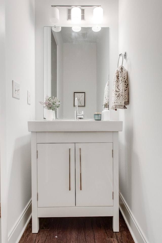 bathroom featuring hardwood / wood-style floors and vanity