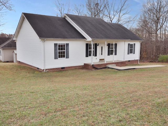 exterior space featuring covered porch and a front yard