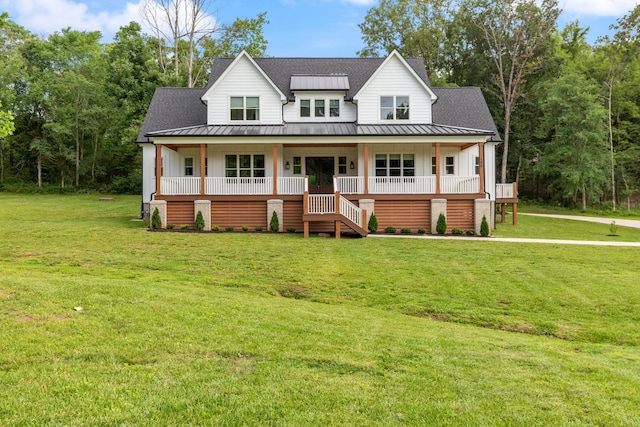 view of front facade with covered porch and a front lawn