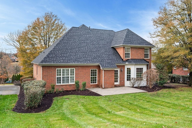 rear view of property with a patio area and a yard