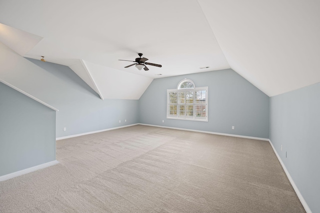 bonus room featuring ceiling fan, light colored carpet, and lofted ceiling