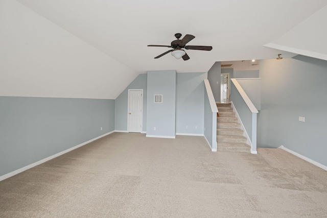 bonus room with ceiling fan, light colored carpet, and lofted ceiling