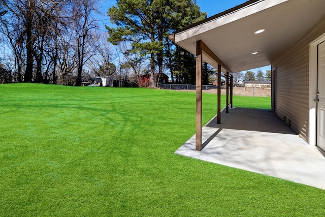 view of yard with a patio and fence