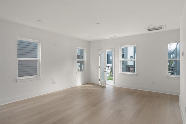 unfurnished room with light hardwood / wood-style floors