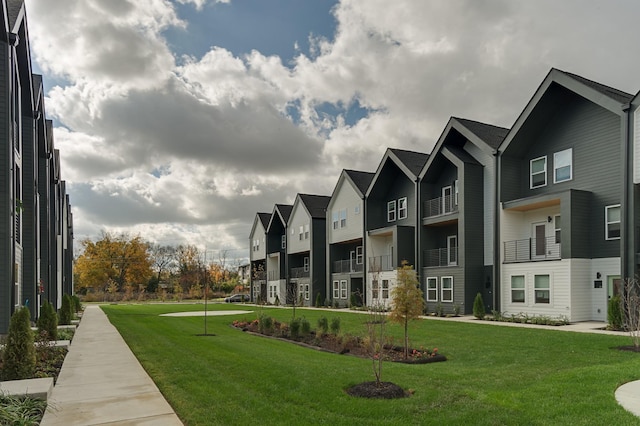 view of property's community with a lawn