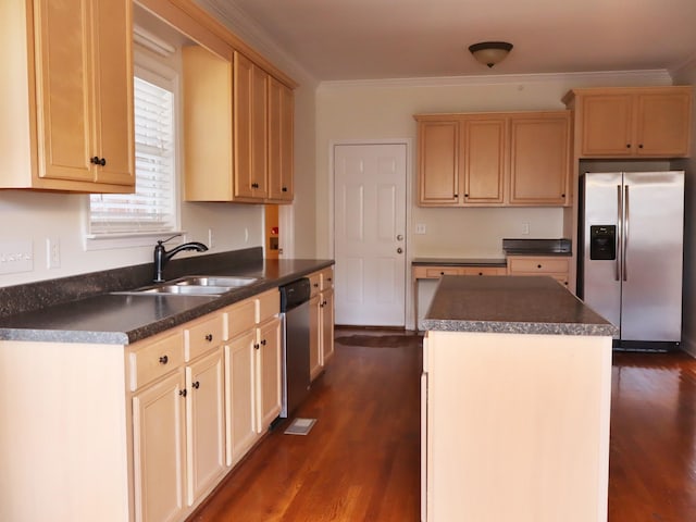 kitchen with sink, a center island, dark wood-type flooring, crown molding, and appliances with stainless steel finishes