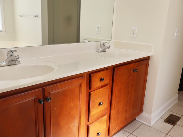 bathroom with tile patterned flooring and vanity