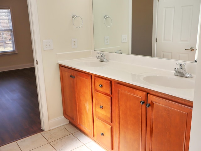 bathroom featuring tile patterned flooring and vanity