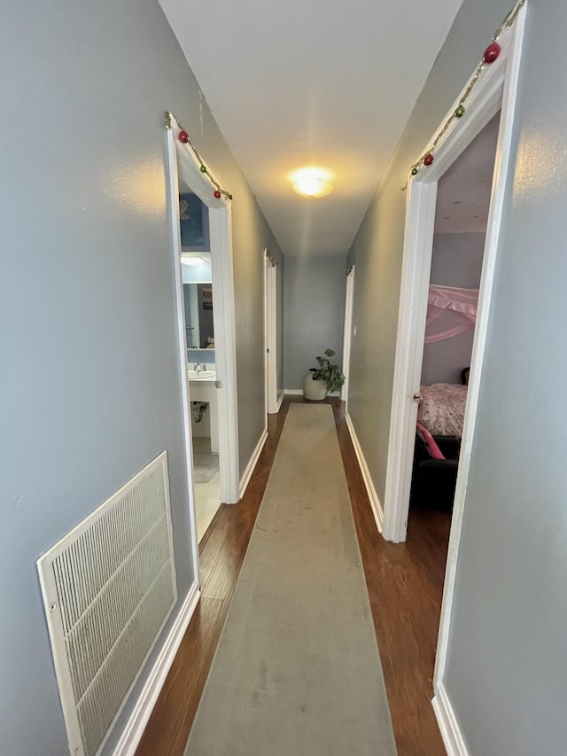 hall with dark hardwood / wood-style floors