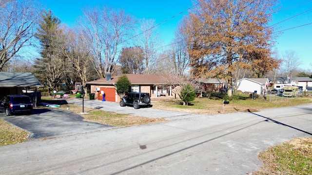 view of front of property with a front lawn and a garage