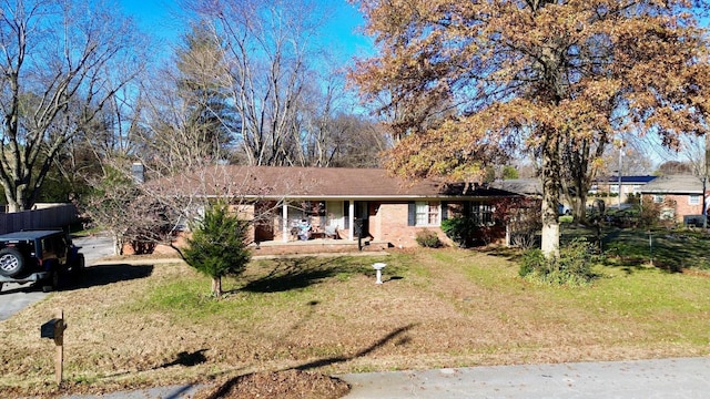 single story home featuring a front yard