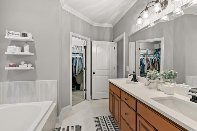 bathroom featuring tiled tub, vanity, and crown molding