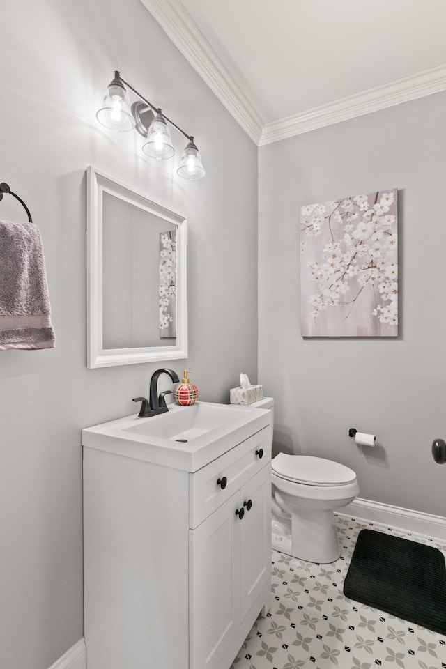 bathroom featuring toilet, crown molding, tile patterned floors, and vanity