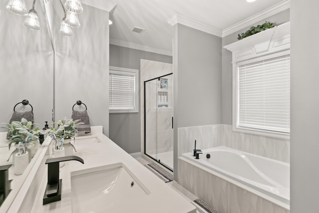 bathroom featuring vanity, crown molding, and shower with separate bathtub