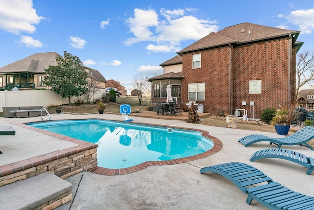 view of swimming pool with a patio