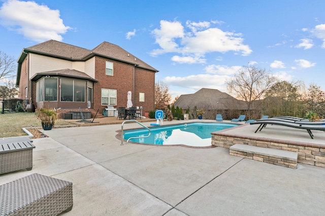 view of pool featuring a patio