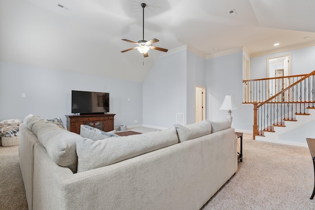 living room featuring vaulted ceiling, ceiling fan, crown molding, and carpet floors