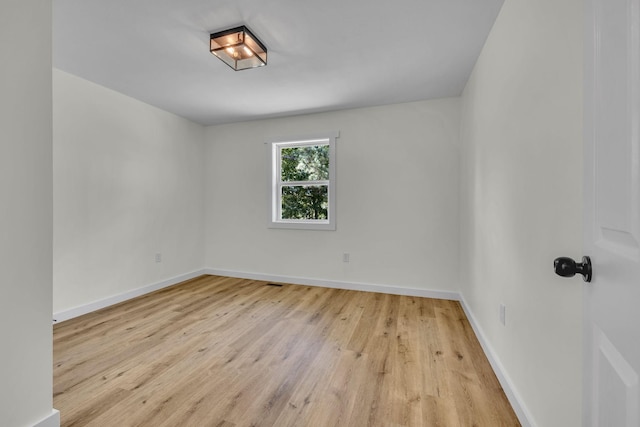 unfurnished room featuring light wood-type flooring