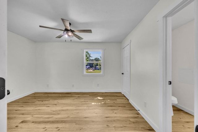 unfurnished bedroom with ceiling fan, light wood-type flooring, and ensuite bathroom