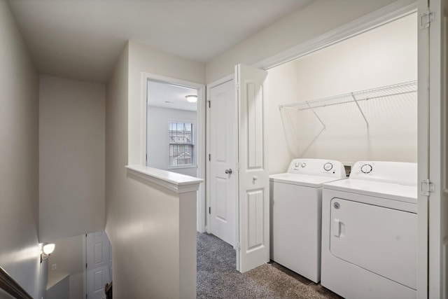 washroom featuring separate washer and dryer and dark colored carpet