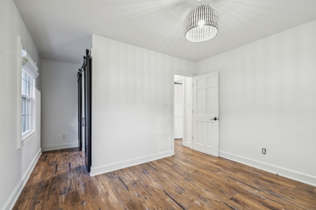 empty room featuring dark wood-type flooring